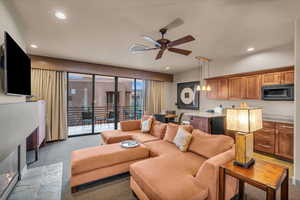 Living room featuring ceiling fan