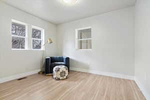 Unfurnished room featuring light wood-type flooring