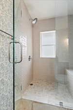 Bathroom with a shower with shower door