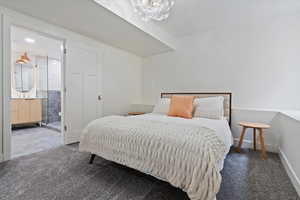 Carpeted bedroom with radiator