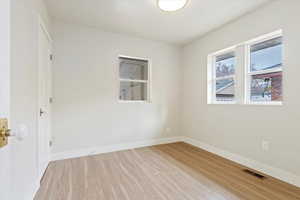 Unfurnished room featuring light hardwood / wood-style floors