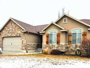 View of front of property featuring a garage