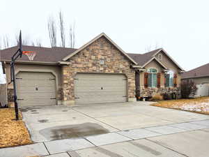 Single story home featuring a 3 car garage