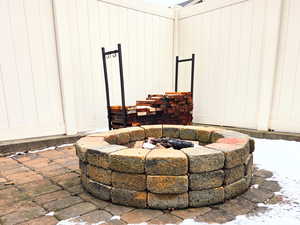 Exterior details featuring an outdoor fire pit