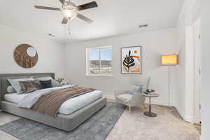 Bedroom with ceiling fan and carpet floors