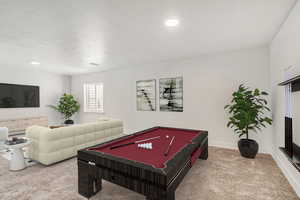 Game room with pool table and carpet