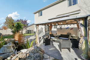 View of patio with an outdoor living space