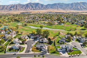 Birds eye view of property with a water and mountain view