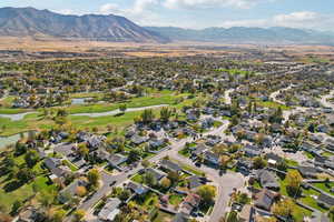 Birds eye view of property with a water and mountain view