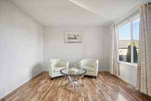 Sitting room with light wood-type flooring