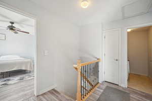 Hallway with light hardwood / wood-style floors