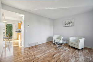 Sitting room featuring light hardwood / wood-style floors