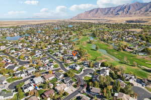 Birds eye view of property featuring a water and mountain view