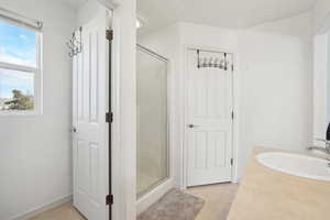 Bathroom with an enclosed shower and vanity