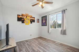 Interior space featuring ceiling fan and light hardwood / wood-style floors