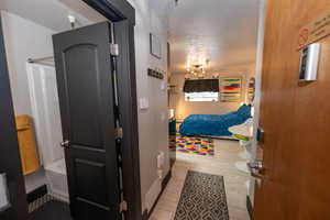 Bedroom with a textured ceiling