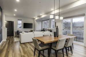 Dining space with light hardwood / wood-style flooring