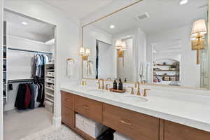 Primary Bathroom with built in features and vanity