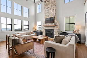 Living room featuring wood-type flooring and a fireplace