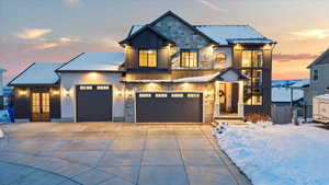 View of front facade featuring a garage