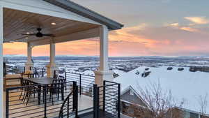 Snow covered deck with ceiling fan