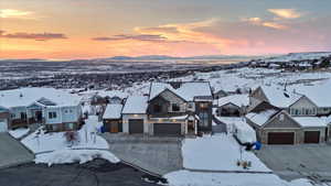 Snowy aerial view featuring a mountain view