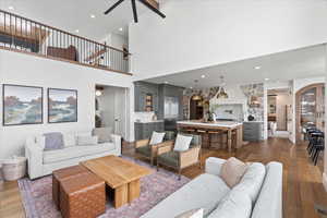 Living room featuring ceiling fan and dark hardwood / wood-style flooring