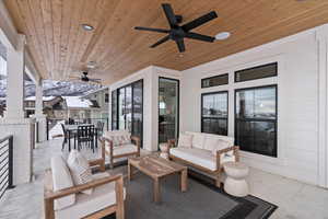 View of patio featuring an outdoor hangout area and ceiling fan