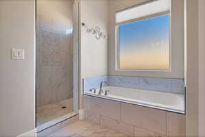 Bathroom featuring separate shower and tub