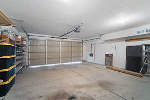 Garage featuring a garage door opener