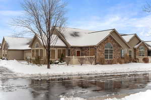 View of front of property with central AC and a garage