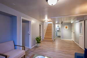 Foyer entrance featuring light hardwood / wood-style flooring