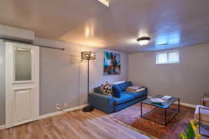 Living room with hardwood / wood-style floors