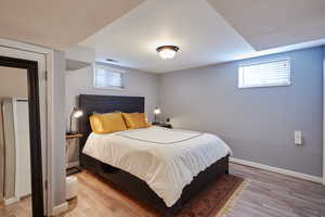 Bedroom with light hardwood / wood-style floors