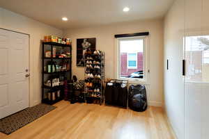 Miscellaneous room featuring plenty of natural light and light hardwood / wood-style floors