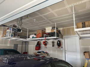 Garage with a garage door opener and electric panel