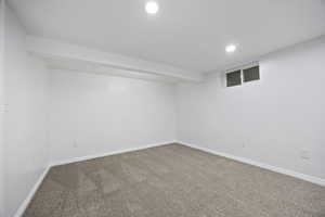 Basement with carpet flooring