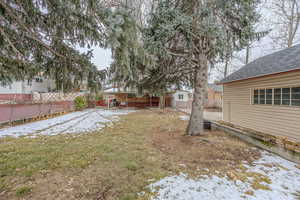 View of yard layered in snow