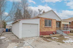 View of property exterior with a garage