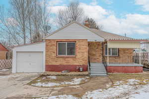 View of front facade featuring a garage