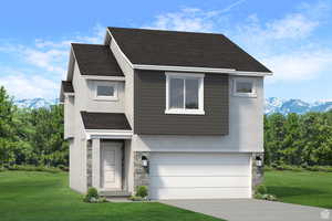 View of front of home featuring a mountain view, a front lawn, and a garage