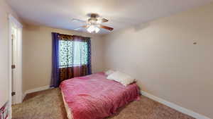 Bedroom with carpet and ceiling fan