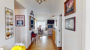 Hallway featuring light tile patterned floors