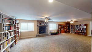 Sitting room with carpet and a textured ceiling