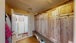 Mudroom featuring light tile patterned floors