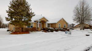 View of front of property featuring cooling unit