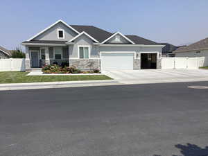 Craftsman house featuring a garage