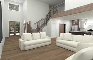 Living room with french doors, sink, dark hardwood / wood-style floors, and a towering ceiling