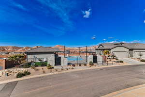 View of front of property featuring a mountain view and a garage