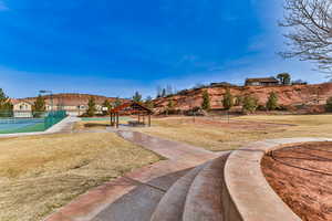 View of yard featuring a gazebo and tennis court